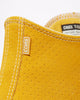 A close up of a yellow CONVERSE CONS CHUCK TAYLOR ALL STAR PRO HI GOLD DART / WHITE / BLACK sneaker.
