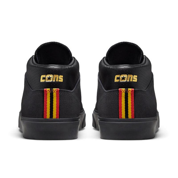A pair of black CONVERSE LOUIE LOPEZ PRO MID sneakers with a red, yellow, and blue stripe.