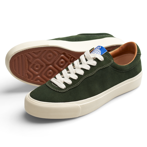 A pair of LAST RESORT AB VM001 SUEDE OLIVE/WHITE sneakers with white soles.
