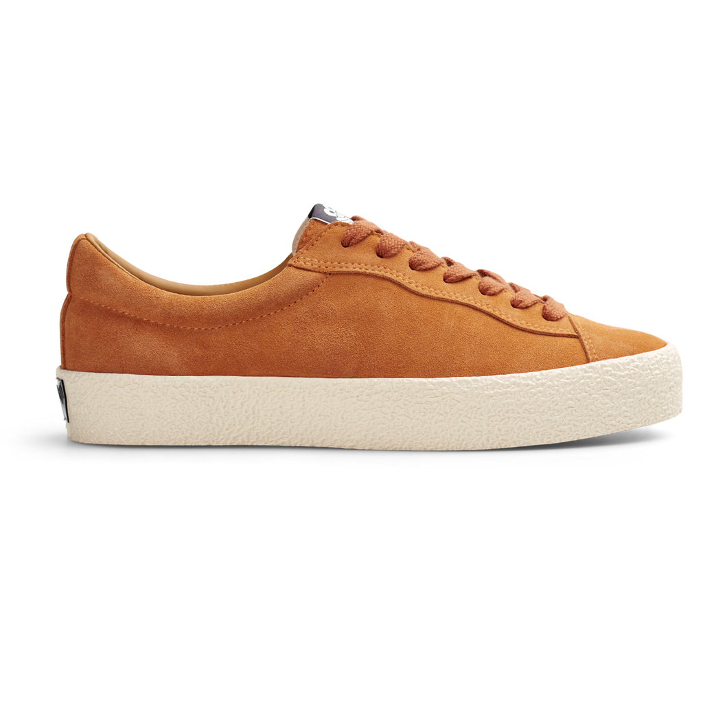 A Last Resort AB tan suede sneaker with a white sole.