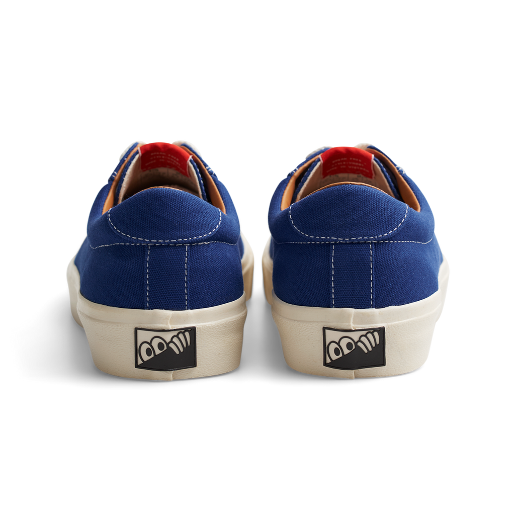 A pair of LAST RESORT AB VM001 TRUE BLUE/WHITE sneakers with a white logo on the side.