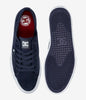 The navy sole of the navy shoes. 