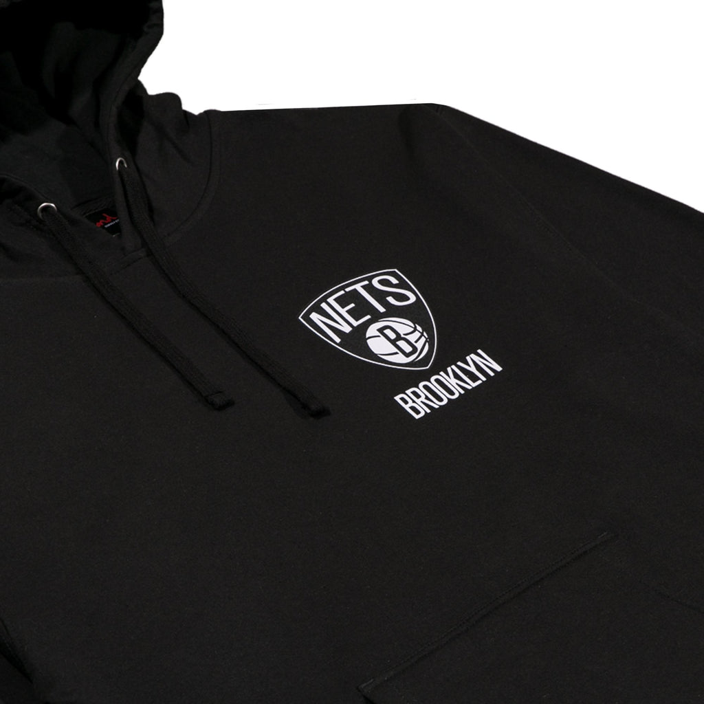 A close up of a black hoodie with the Nets logo on the left chest.