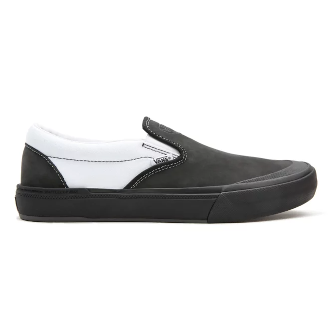 A black and white slip on shoe with a black sole