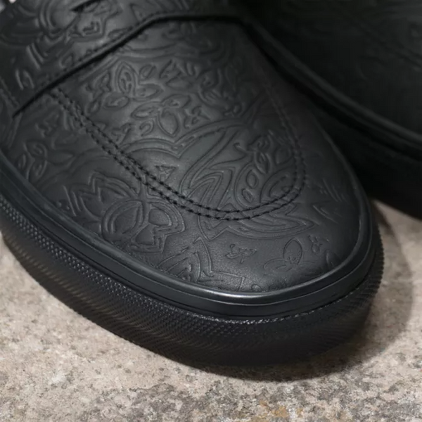 A pair of VANS SKATE STYLE 53 BEATRICE DOMAND BLACK lace-up sneakers with a floral pattern by VANS.
