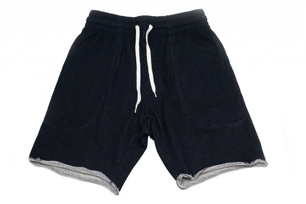 A pair of BLUETILE SURPLUS SWEAT SHORT NAVY from Bluetile Skateboards with white drawstrings.