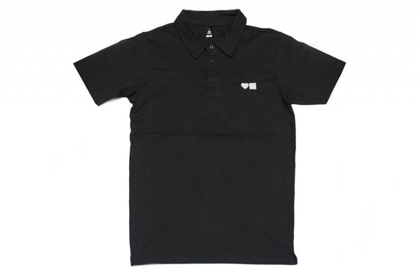 A BLUETILE SURPLUS LOVE BLUETILE POLO BLACK / WHITE polo shirt from Bluetile Skateboards with a white logo on it.