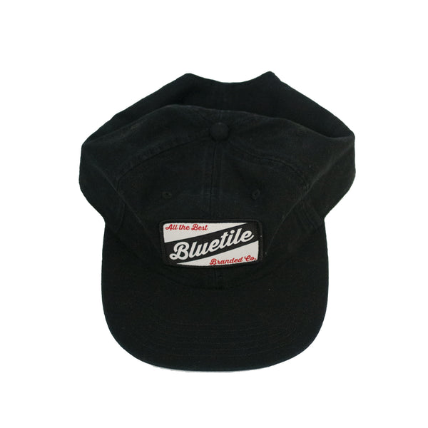 A BLUETILE CRAFT PATCH HAT BLACK with the word 'blueline' embroidered on it and a blue tile patch. Brand: Bluetile Skateboards