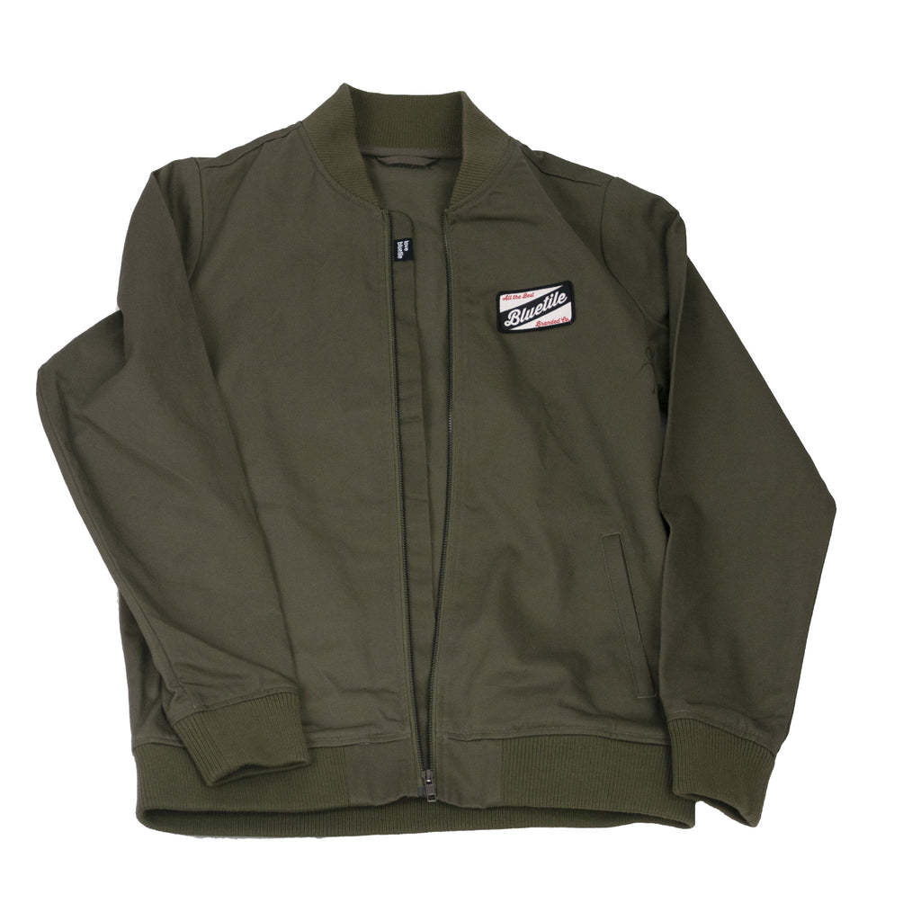 A Bluetile Craft bomber jacket with a patch on it.