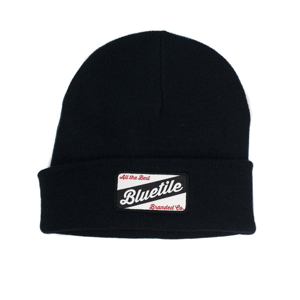 A BLUETILE CRAFT PATCH BEANIE NAVY with a bluttle patch on it by Bluetile Skateboards.