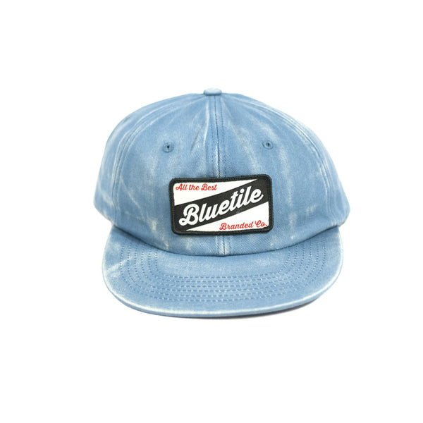 A BLUETILE CRAFT PATCH HAT FADED DENIM with a patch on it. (Brand: Bluetile Skateboards)
