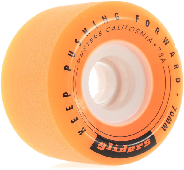 Close-up of an orange DUSTERS GLIDERS 70MM 78A wheel with the text "Keep Pushing Forward" and "Gliders" printed on it, featuring smooth 70mm wheels.