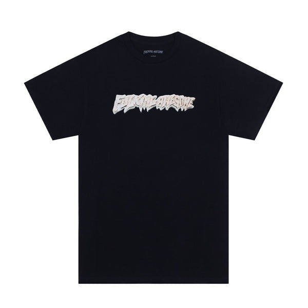 Original Sentence: Black T-shirt with a white graffiti-style logo on the chest, featuring a 24K stamp.
Revised Sentence: FUCKING AWESOME 24K STAMP T-SHIRT BLACK by FUCKING AWESOME.