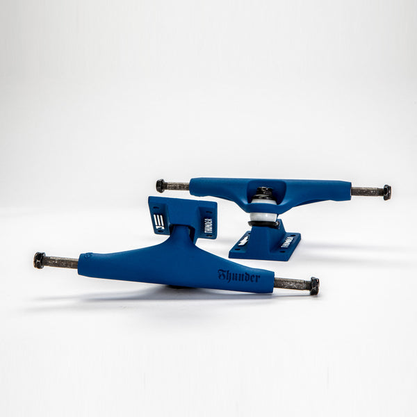 A pair of THUNDER TRUCKS 148 DIPPED SCRIPT BLUE (SET OF TWO) skateboard trucks on a white background.