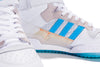 A pair of ADIDAS DIEGO FORUM 84 MID ADV CHALK WHITE / CLOUD WHITE sneakers on a white surface.
