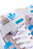 A pair of ADIDAS DIEGO FORUM 84 MID ADV CHALK WHITE / CLOUD WHITE sneakers with blue and white accents.