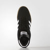 A pair of ADIDAS BUSENITZ CORE BLACK / WHITE / GOLD sneakers on a white background.
