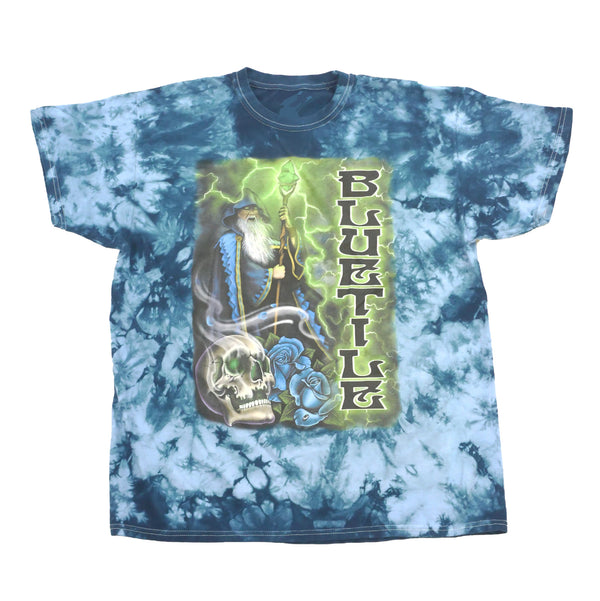 A BLUETILE TRIPPY WIZARD T-SHIRT MYSTIC BLUE with an image of a wizard, by Bluetile Skateboards.