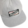 A grey hat with a craft patch on it that says Bluetile Skateboards.