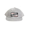 A BLUETILE CRAFT PATCH HAT GREY CORDUROY with the word 'buzzle' embroidered on it, from Bluetile Skateboards.