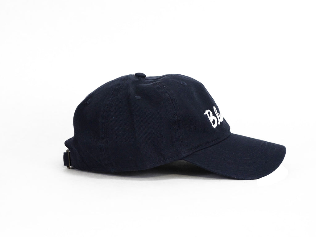 A navy BLUETILE CURSIVE DAD HAT with the word 'boston' embroidered on it.