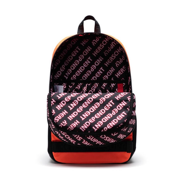 the inside of a backpack with a black background and a red/white repetitive independent logo