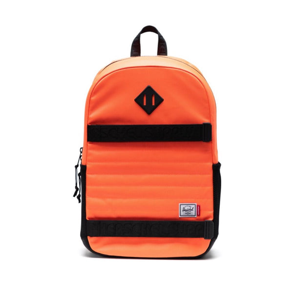 a bright orange backpack with black straps
