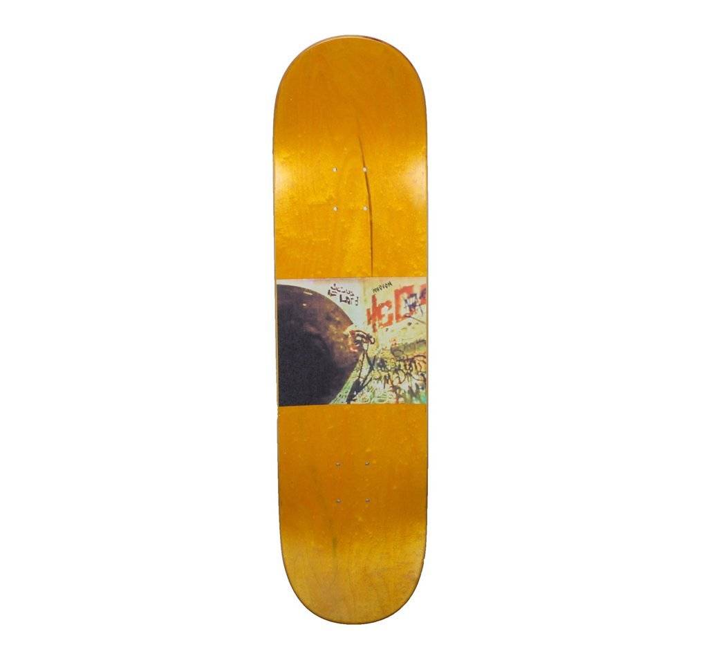 The HOCKEY DONOVON ULTRA VIOLET skateboard deck by HOCKEY showcases a vibrant yellow background with a striking central multicolored graphic that includes abstract designs, text, and elements resembling a cityscape.