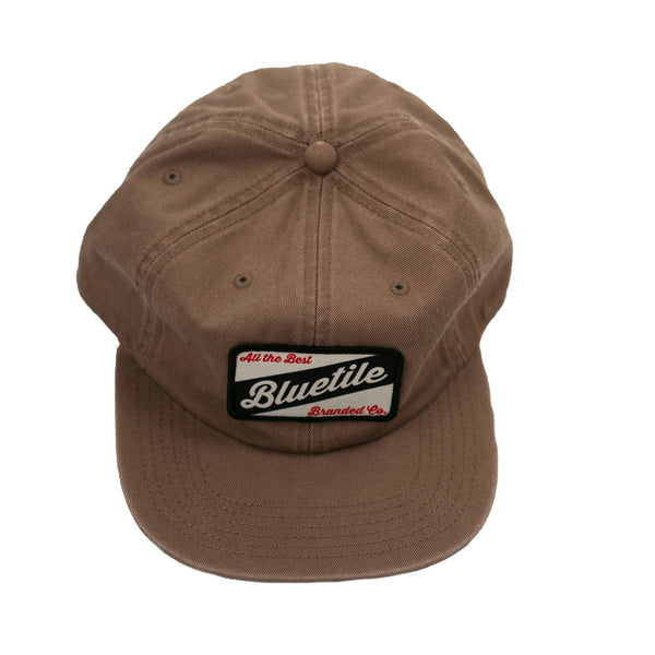 A Bluetile Craft Patch Hat Coffee with a patch on it.