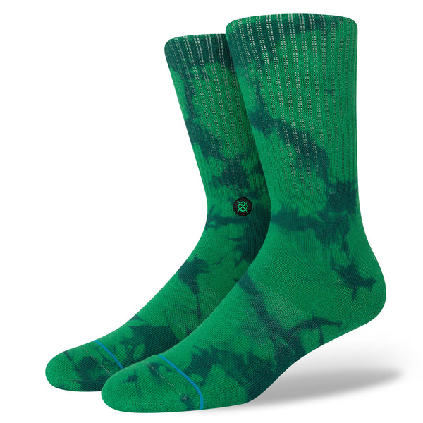 A pair of STANCE SOCKS LIMPID GREEN LARGE with a camouflage pattern on a white background.