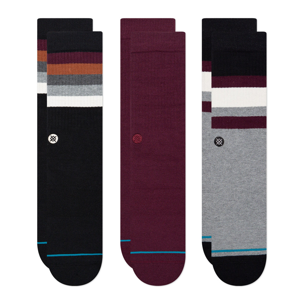 Three pairs of calf-length STANCE SOCKS THE PORTO 3 PACK MULTI LARGE, featuring different color patterns and small logo details.