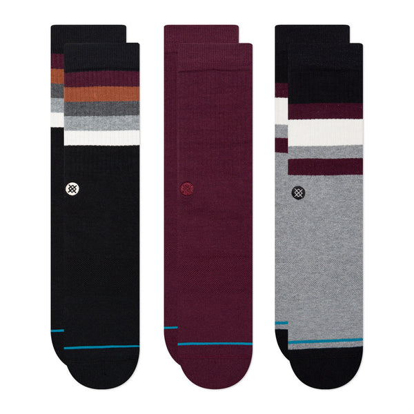 Three pairs of calf-length STANCE SOCKS THE PORTO 3 PACK MULTI LARGE, featuring different color patterns and small logo details.