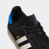 A black and white ADIDAS CAMPUS ADV X MAXALLURE sneakers with blue accents.