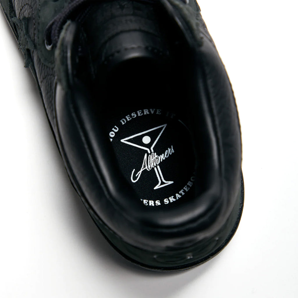 A close up of a CONVERSE CONS X ALLTIMERS FASTBREAK PRO BLACK shoe on a white surface.