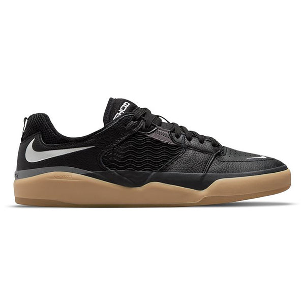 The NIKE SB ISHOD PRM BLACK / WHITE / DARK GREY skateboards - black and gum shoes.
