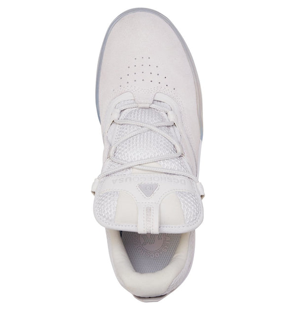 A pair of DC Kalis SE grey/white sneakers with a white sole by DC.