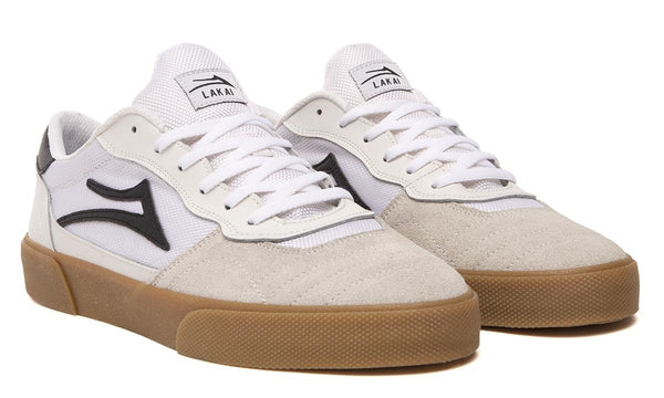 A pair of LAKAI CAMBRIDGE WHITE / BLACK sneakers with gum soles from LAKAI.
