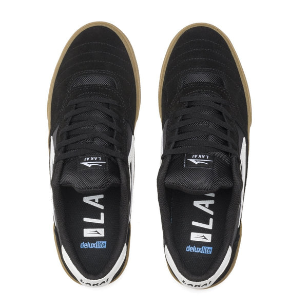 A pair of black and white LAKAI CAMBRIDGE BLACK / GUM sneakers with white soles.