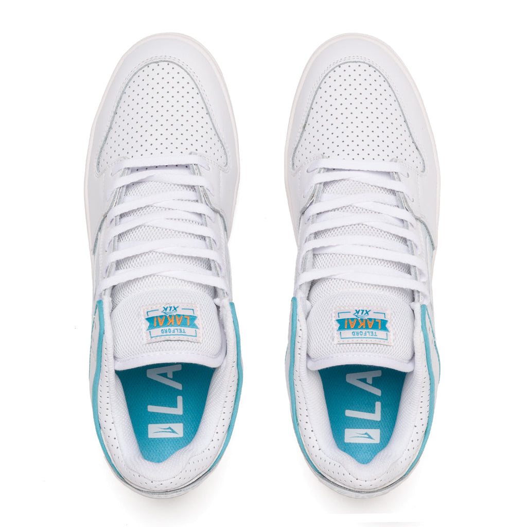 A pair of white and blue LAKAI ROB WELSH TELFORD LOW WHITE LEATHER sneakers.