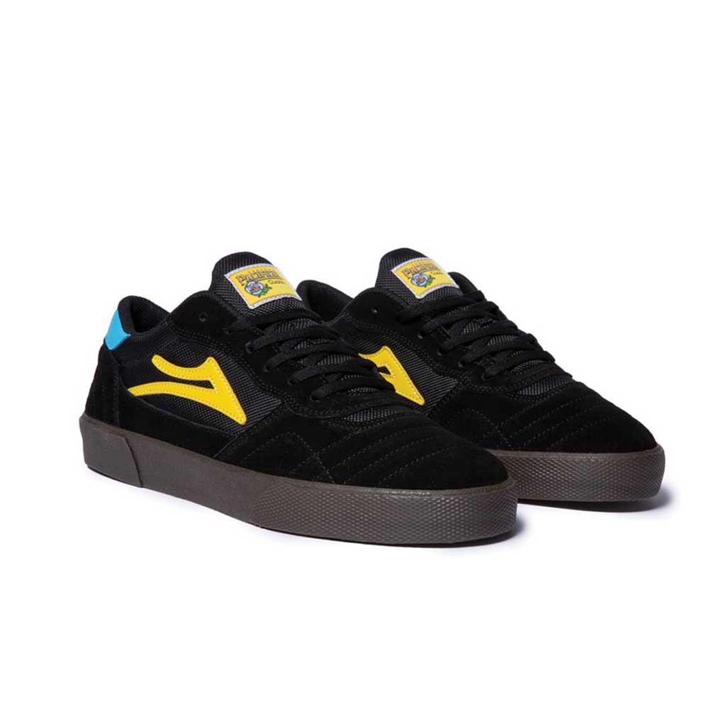 A LAKAI X PACIFICO CAMBRIDGE BLACK/GUM SUEDE sneaker with yellow accents by LAKAI.