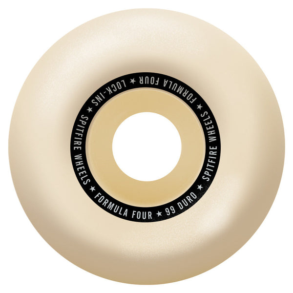 Close-up of a beige skateboard wheel featuring bold black text around the center that reads "SPITFIRE F4 LOCK-INS 99D 57MM" from the brand SPITFIRE.