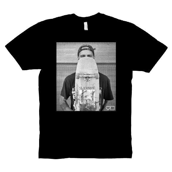 A BLUETILE X SLAMMIN LOVEDALE T-SHIRT BLACK with a photo of a man holding a skateboard, exclusively available at Bluetile Skateboards.