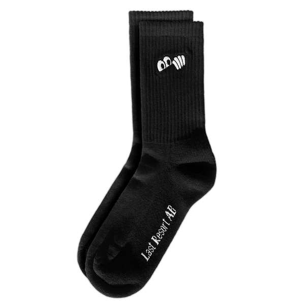 A pair of black crew socks with Last Resort AB logo embroidery on the side.