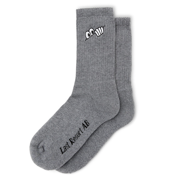 Pair of grey LAST RESORT AB Eye Socks with white logo on the cuff and Last Resort AB text on the side.