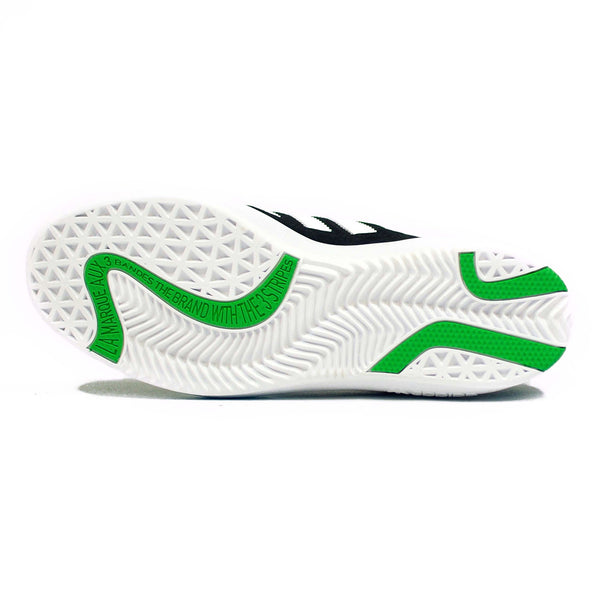 A white and green ADIDAS PUIG CORE BLACK / WHITE / GREEN tennis shoe on a white surface.