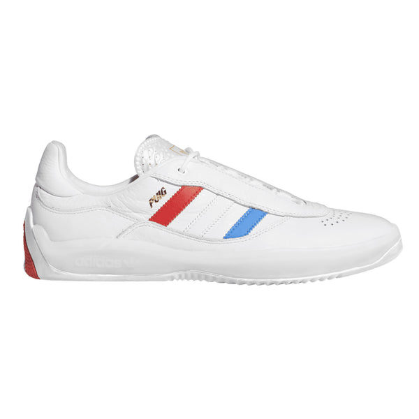 a white shoe with red and blue stripes on the side and a gold Puig text