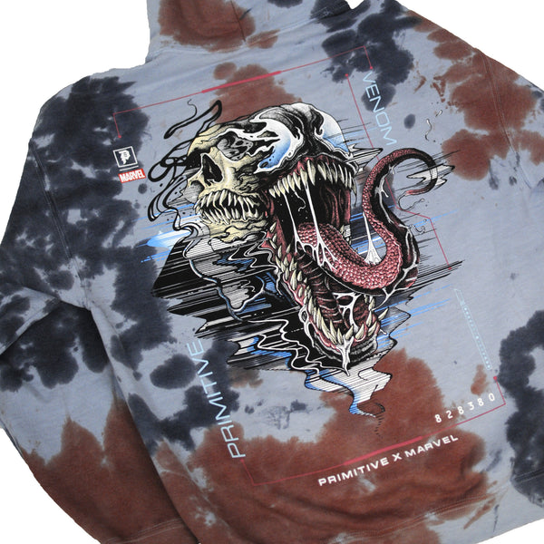 The PRIMITIVE VENOM HOODIE WASHED BLUE features a tie-dye wash, Venom graphic with extended tongue, and bold "Primitive x Marvel" branding for standout streetwear style.