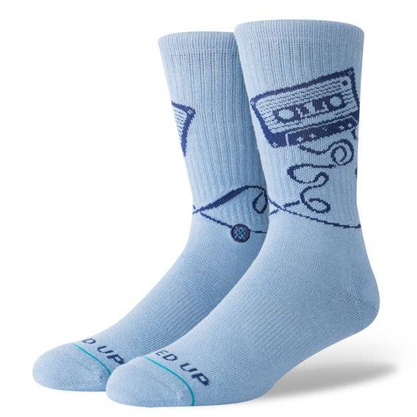 A pair of STANCE SOCKS MIXED BLUE LARGE with a graphic design featuring a cassette tape and musical notes.