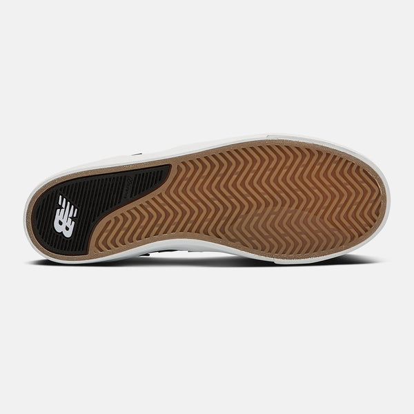 The sole of a NB NUMERIC FOY 306 GREY / BLACK shoe on a white background, featuring the keywords "NB NUMERIC".