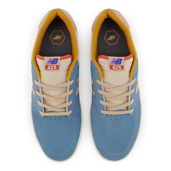 A pair of NB NUMERIC 425 BLUE / CREAM sneakers in blue and orange, specifically designed with the NB numeric logo.